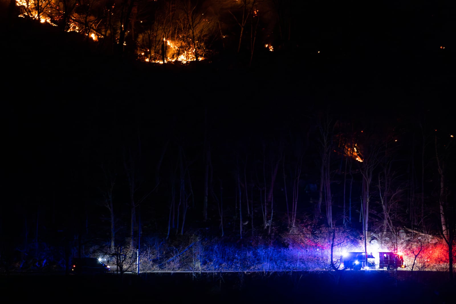 Firefighters attend the wildfires as they burn along the New York and New Jersey border in Greenwood Lake, New York, Wednesday, Nov. 13, 2024. (AP Photo/Eduardo Munoz Alvarez)