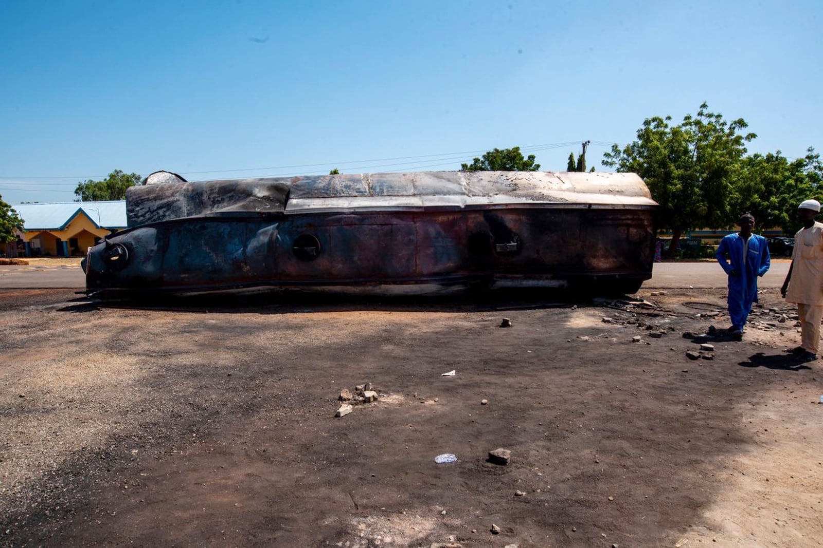 People gather at the scene of a tanker explosion in Majiya town, Nigeria, Wednesday, Oct. 16, 2024. (AP Photo/Sani Maikatanga)