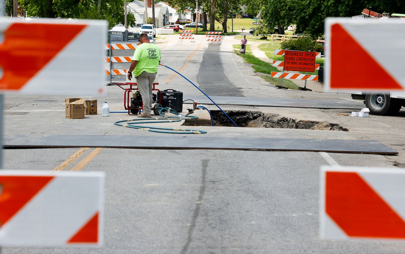 Millville avenue at Donna Avenue is closed for water main work with a large hole in the middle of the intersection Thursday, July 18, 2024 in Hamilton. NICK GRAHAM/STAFF