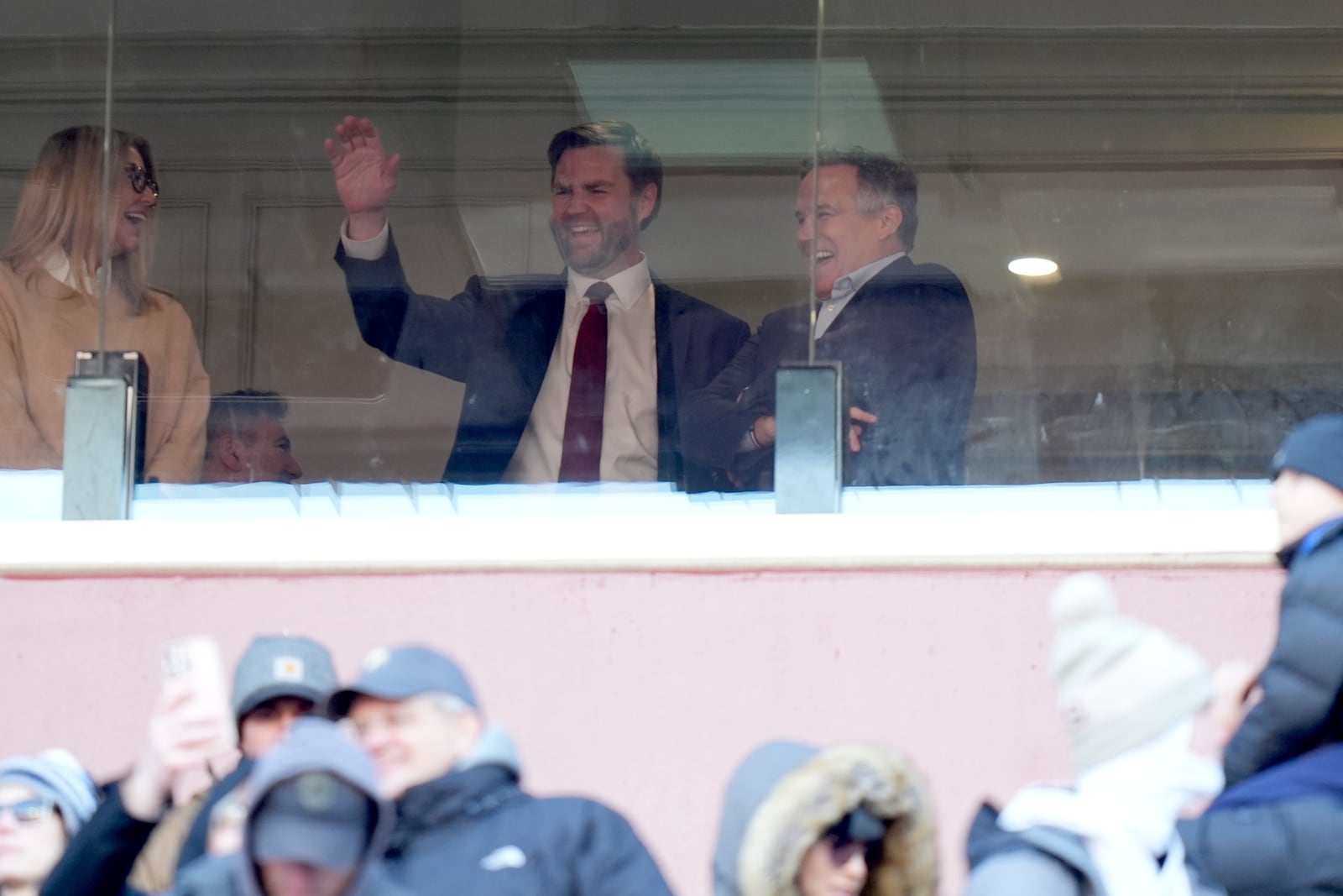 Vice President-elect JD Vance waves joined by Senator-elect Dave McCormick, R-Pa., right, at the NCAA college football game between Army and Navy at Northwest Stadium in Landover, Md., Saturday, Dec. 14, 2024. (AP Photo/Stephanie Scarbrough)