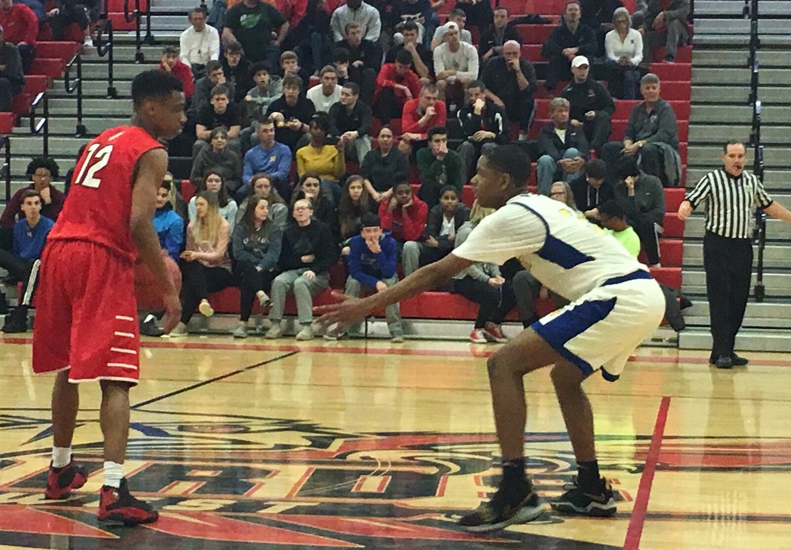 Fairfield’s Blake Spaulding (12) and Northwest’s Tyre McKinney (3) square off during Saturday’s Division I sectional game at Lakota West. RICK CASSANO/STAFF