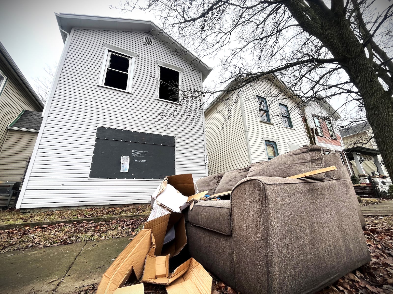 This home on Hoch Street in East Dayton was sold in January 2023 for $1,000. The property owes more than $8,400 in delinquent taxes. CORNELIUS FROLIK / STAFF