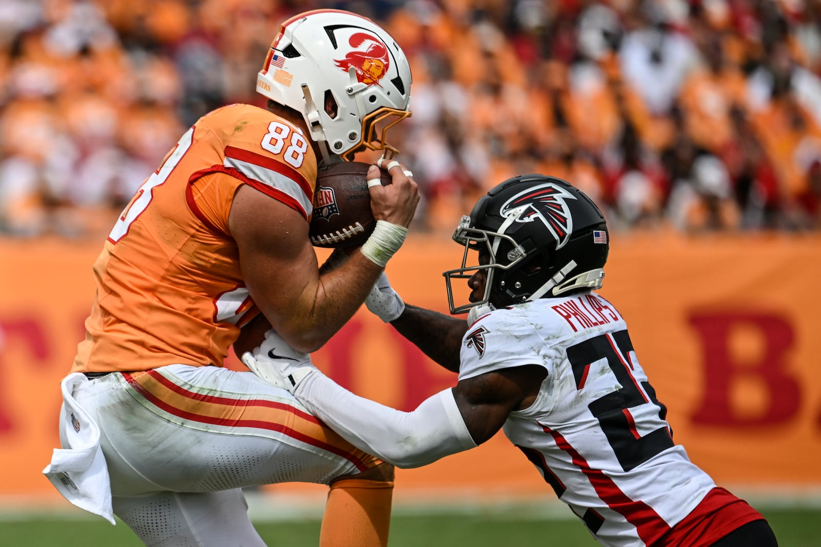 Tampa Bay Buccaneers tight end Cade Otton (88) makes the catch against Atlanta Falcons cornerback Clark Phillips III (22) during the first half of an NFL football game, Sunday, Oct. 27, 2024, in Tampa. (AP Photo/Jason Behnken)