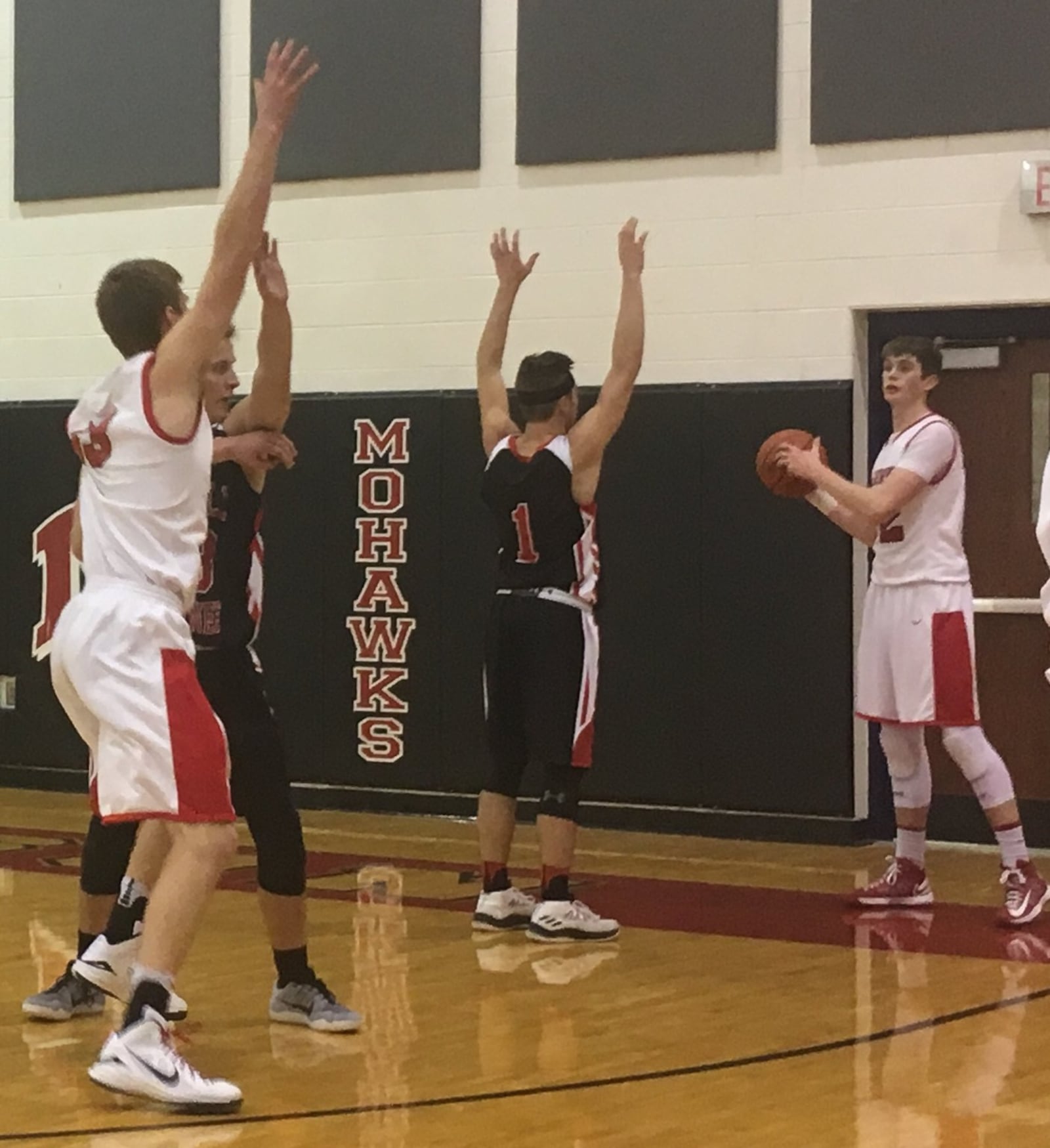 Madison’s Levi McMonigle (33) looks for an inbounds pass from teammate Grant Whisman as Preble Shawnee’s Joey Bates (23) and Chase Thompson (1) defend Saturday night at Madison. RICK CASSANO/STAFF