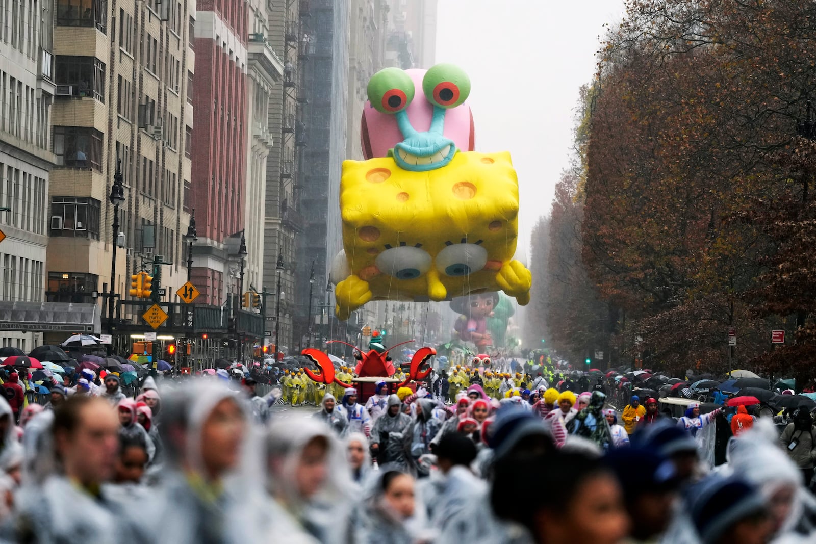 The SpongeBob SquarePants & Gary balloon floats in the Macy's Thanksgiving Day Parade on Thursday, Nov. 28, 2024, in New York. (Photo by Charles Sykes/Invision/AP)