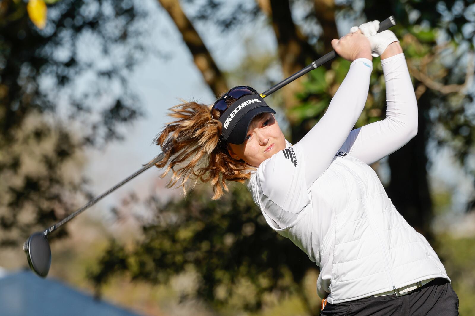 Brooke Henderson tees off the first hole during the first round of the Hilton Grand Vacations Tournament of Champions LPGA golf tournament in Orlando, Fla., Thursday, Jan. 30, 2025. (AP Photo/Kevin Kolczynski)