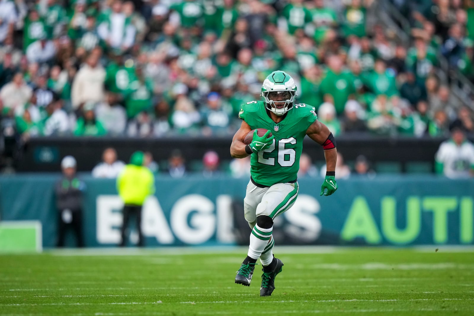 Philadelphia Eagles running back Saquon Barkley (26) runs the ball against the Dallas Cowboys during the second half of an NFL football game, Sunday, Dec. 29, 2024, in Philadelphia. (AP Photo/Matt Slocum)