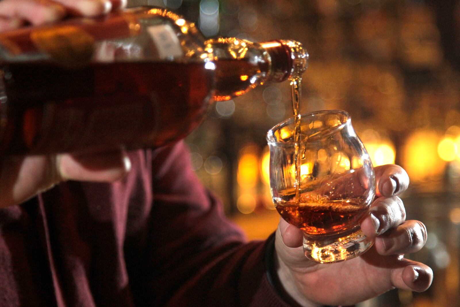 The Century Bar in downtown Dayton is known for a vast selection of bourbons and whiskeys. LISA POWELL / STAFF