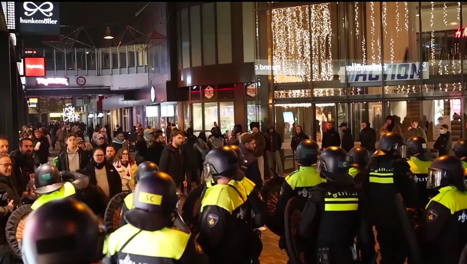 In this image taken from video, police stand guard forming a line near the Ajax stadium, in Amsterdam, the Netherlands, Thursday, Nov. 7, 2024. (AP Photo InterVision)