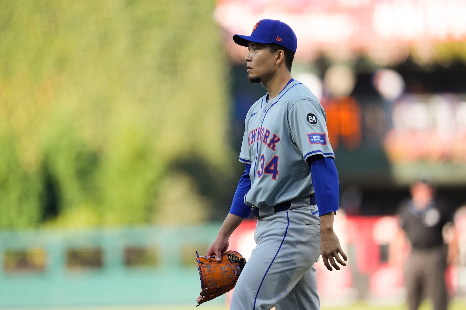 New York Mets pitcher Kodai Senga walks to the dugout during the second inning of Game 1 of a baseball NL Division Series against the Philadelphia Phillies, Saturday, Oct. 5, 2024, in Philadelphia. (AP Photo/Chris Szagola)