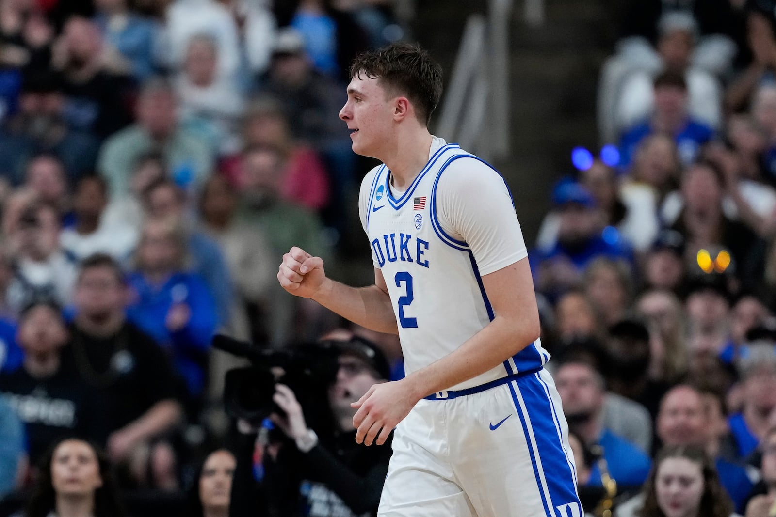 Duke forward Cooper Flagg (2) reacts after center Patrick Ngongba II scores to end the first half in the first round of the NCAA college basketball tournament against Mount St. Mary's, Friday, March 21, 2025, in Raleigh, N.C. (AP Photo/Stephanie Scarbrough)