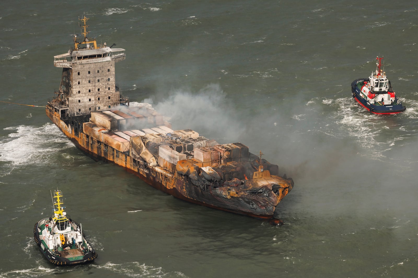 Smoke billows from the MV Solong cargo ship in the North Sea, off the Yorkshire coast, Tuesday, March 11, 2025, in England. (Dan Kitwood/Pool Photo via AP)