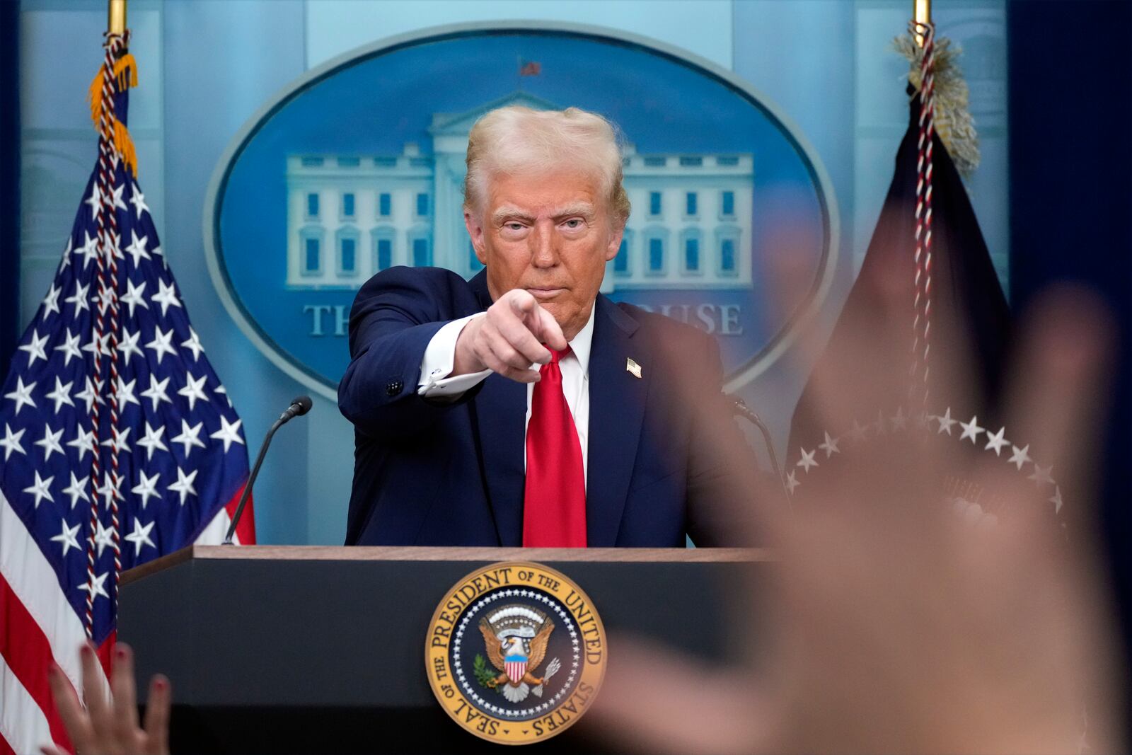 President Donald Trump calls on a reporter to ask a question in the James Brady Press Briefing Room at the White House, Thursday, Jan. 30, 2025, in Washington. (AP Photo/Alex Brandon)