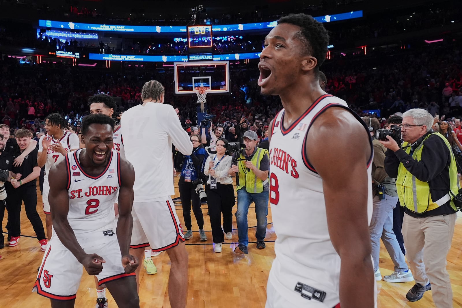 St. John's Sadiku Ibine Ayo (2) and Vince Iwuchukwu (8) celebrate after an NCAA college basketball game against Creighton in the championship of the Big East Conference tournament Saturday, March 15, 2025, in New York. (AP Photo/Frank Franklin II)