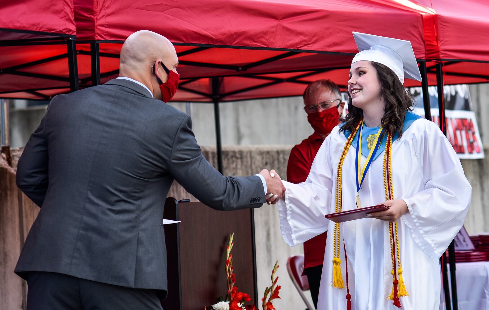 Madison High School drive-thru graduation ceremony at Land of Illusion