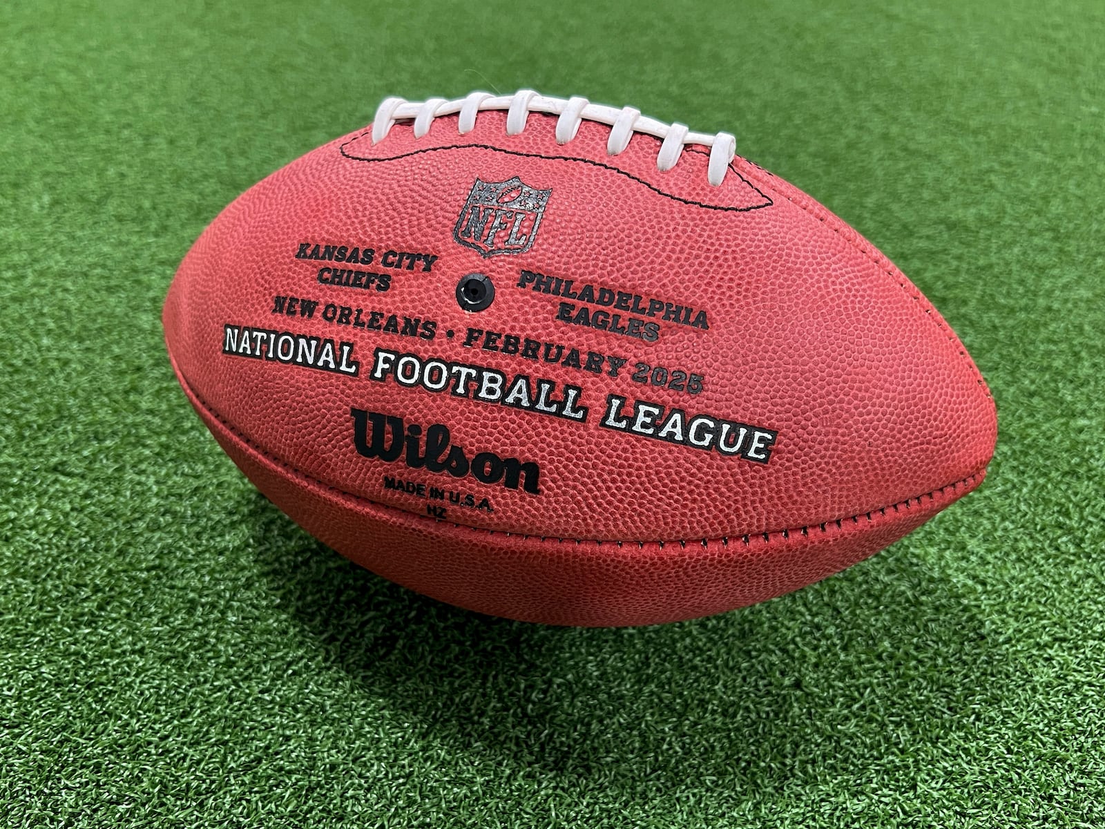 One of the official balls for the NFL Super Bowl football game is seen at the Wilson Sporting Goods football factory, Monday, January 27, 2025, in Ada, Ohio. (AP Photo/Patrick Aftoora-Orsagos)