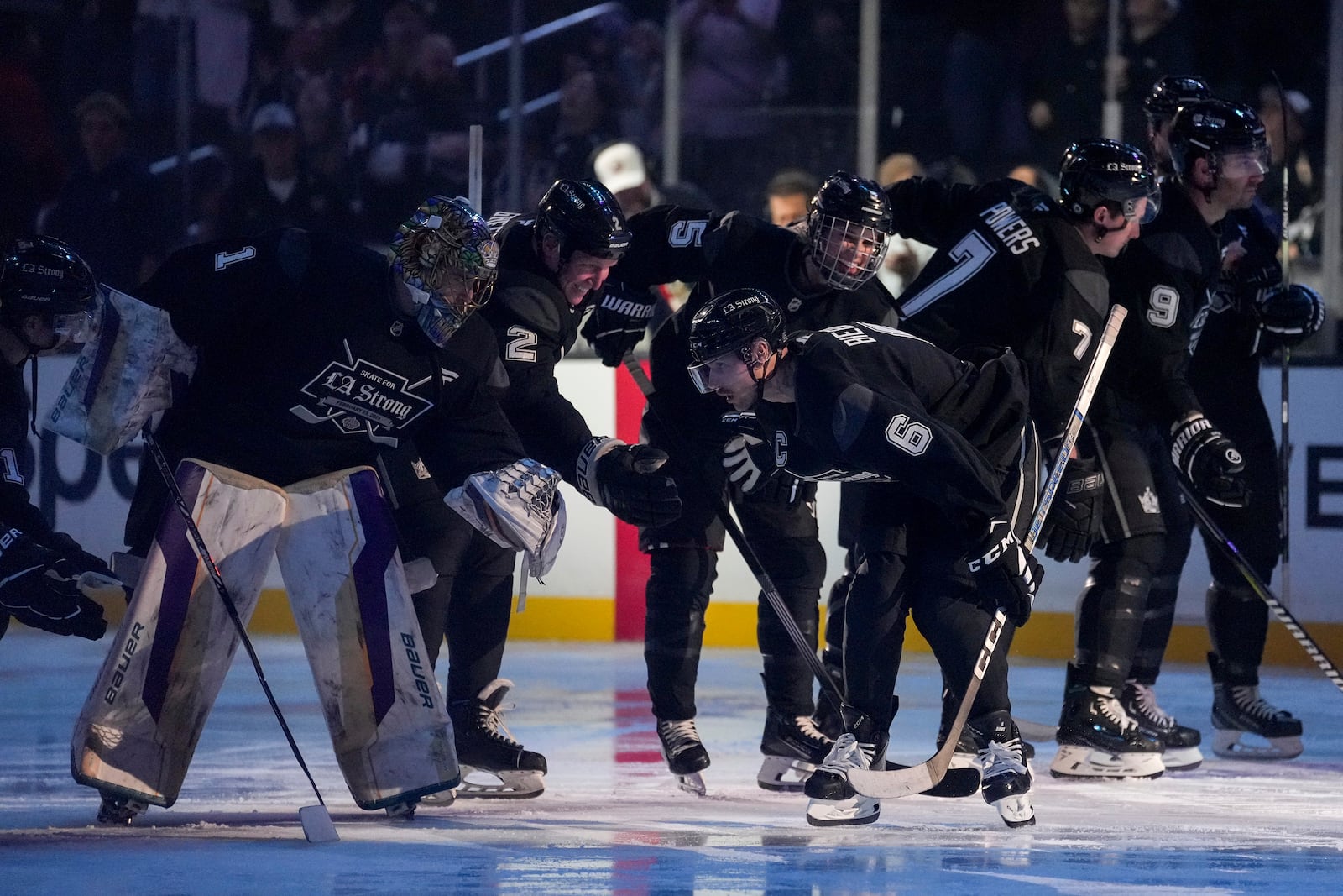 Team Black player singer Justin Bieber high fives teammates during the Skate for LA Strong celebrity hockey game, Sunday, Feb. 23, 2025, in Los Angeles. (AP Photo/Eric Thayer)