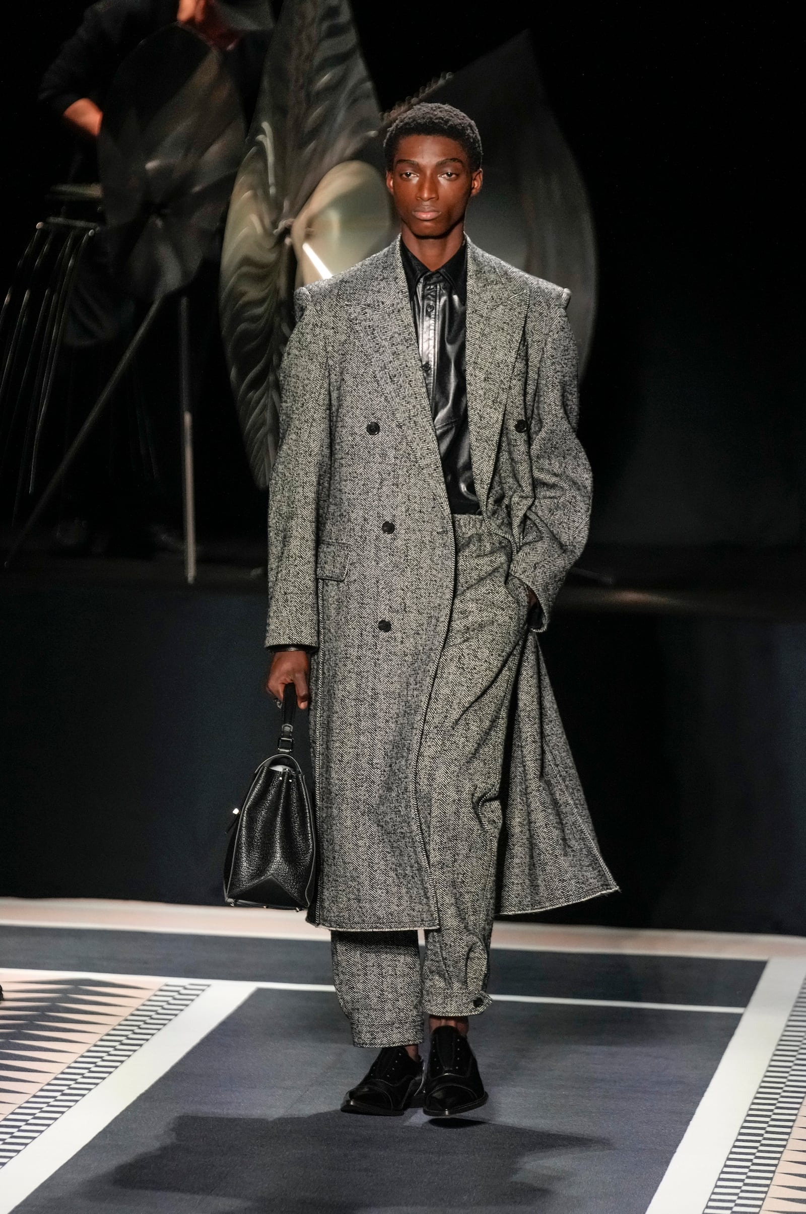 A model wears a creation for the men's Lanvin Fall-Winter 2025-2026 collection, that was presented in Paris, Sunday, Jan. 26, 2025. (AP Photo/Michel Euler)