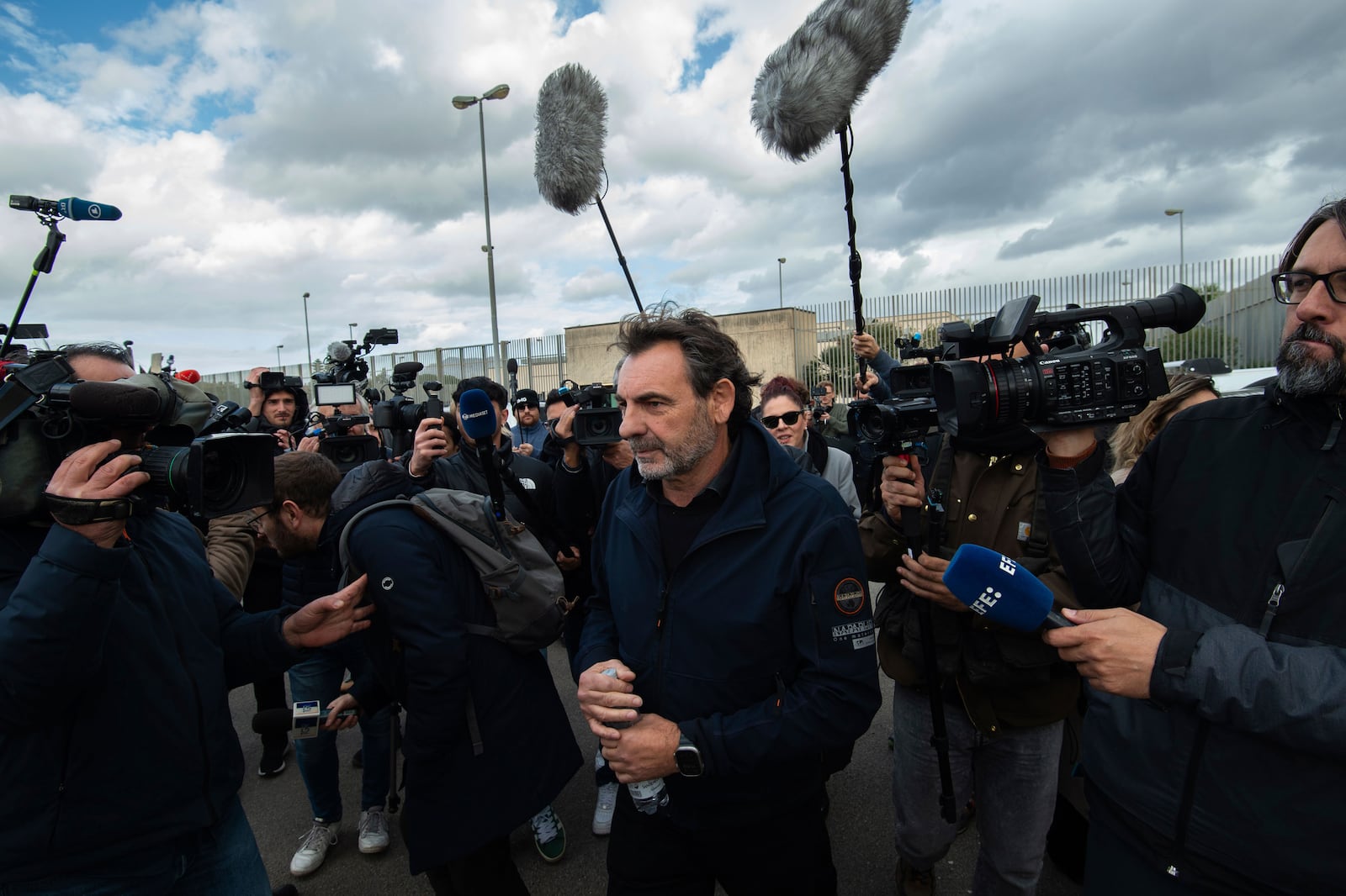 Open Arms founder Oscar Camps arrives at the Palermo's court Friday Dec. 20, 2024 as Italy's deputy premier Matteo Salvini awaits a verdict for preventing some 100 migrants from disembarking the rescue boat in 2019 when he was interior minister. (AP Photo/Salvatore Cavalli)