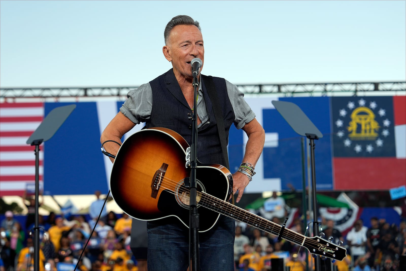 Bruce Springsteen performs before Democratic presidential nominee Vice President Kamala Harris speaks at a campaign rally at James R. Hallford Stadium, Thursday, Oct. 24, 2024, in Clarkston, Ga. (AP Photo/Julia Demaree Nikhinson)