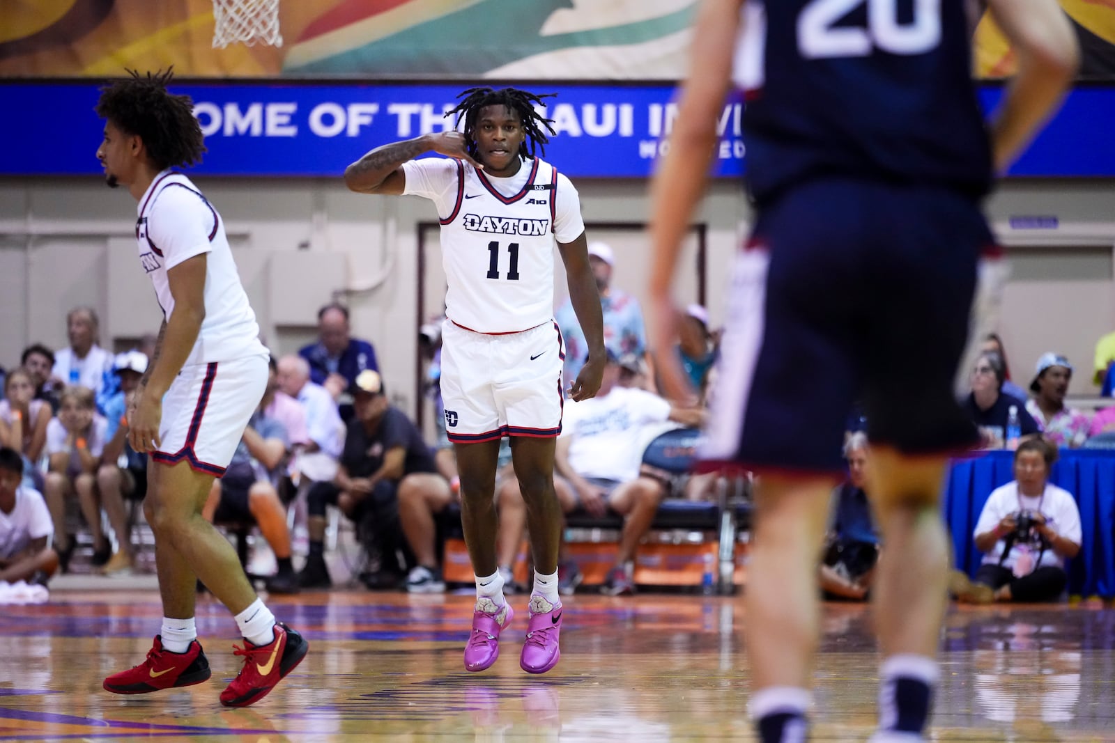 Dayton guard Malachi Smith (11) reacts after making a basket against UConnduring the first half of an NCAA college basketball game at the Maui Invitational Wednesday, Nov. 27, 2024, in Lahaina, Hawaii. (AP Photo/Lindsey Wasson)