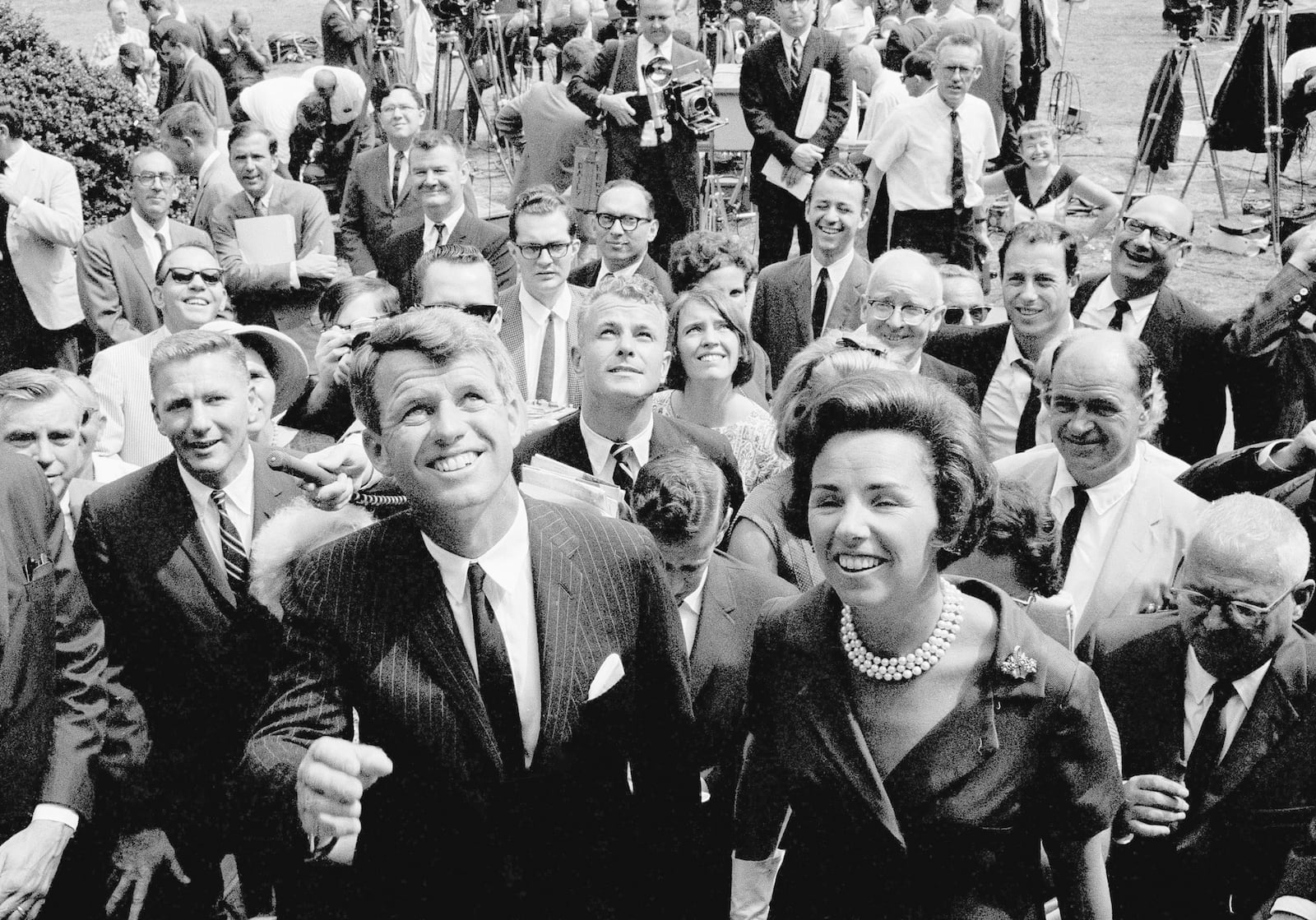 FILE - Atty. Gen. Robert F. Kennedy, front, waves with his wife, Ethel Kennedy, right, shortly after announcing he will seek the Democratic nomination for the U.S. senate from New York at Gracie Mansion, the official residence of New York Mayor Robert Wagner, in New York, Aug. 25, 1964. (AP Photo, File)