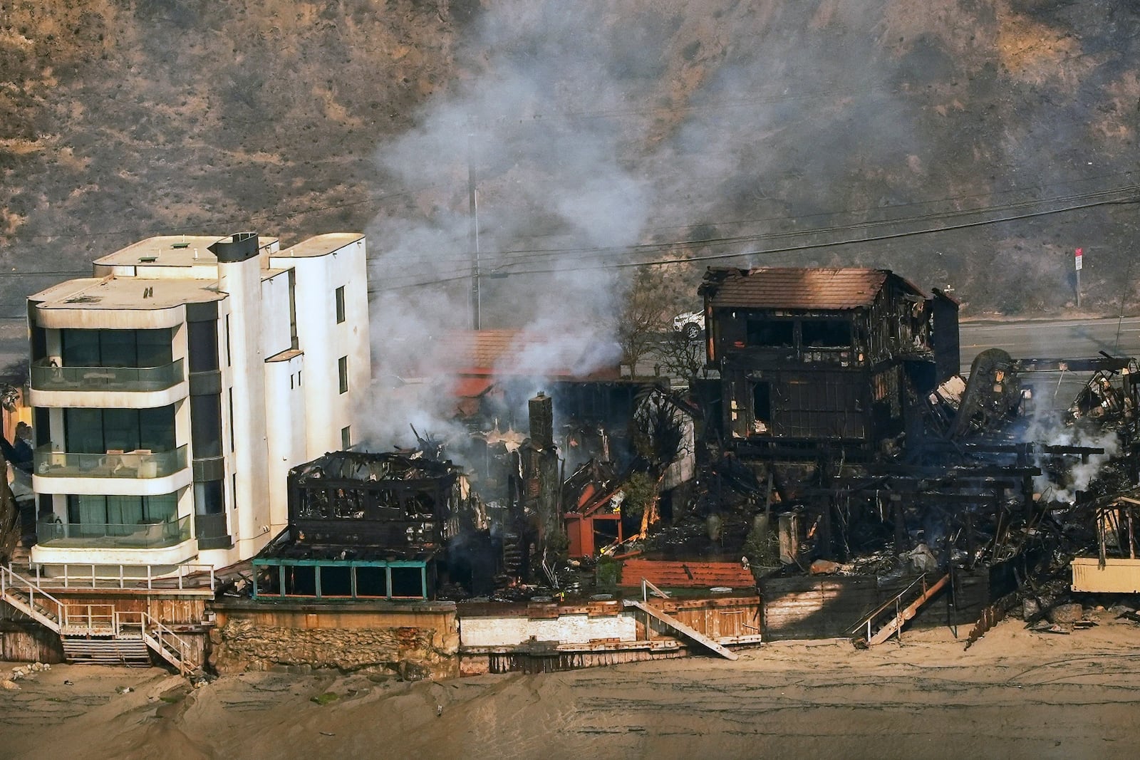 Beachfront properties are left destroyed by the Palisades Fire, Thursday, Jan. 9, 2025 in Malibu, Calif. (AP Photo/Mark J. Terrill)