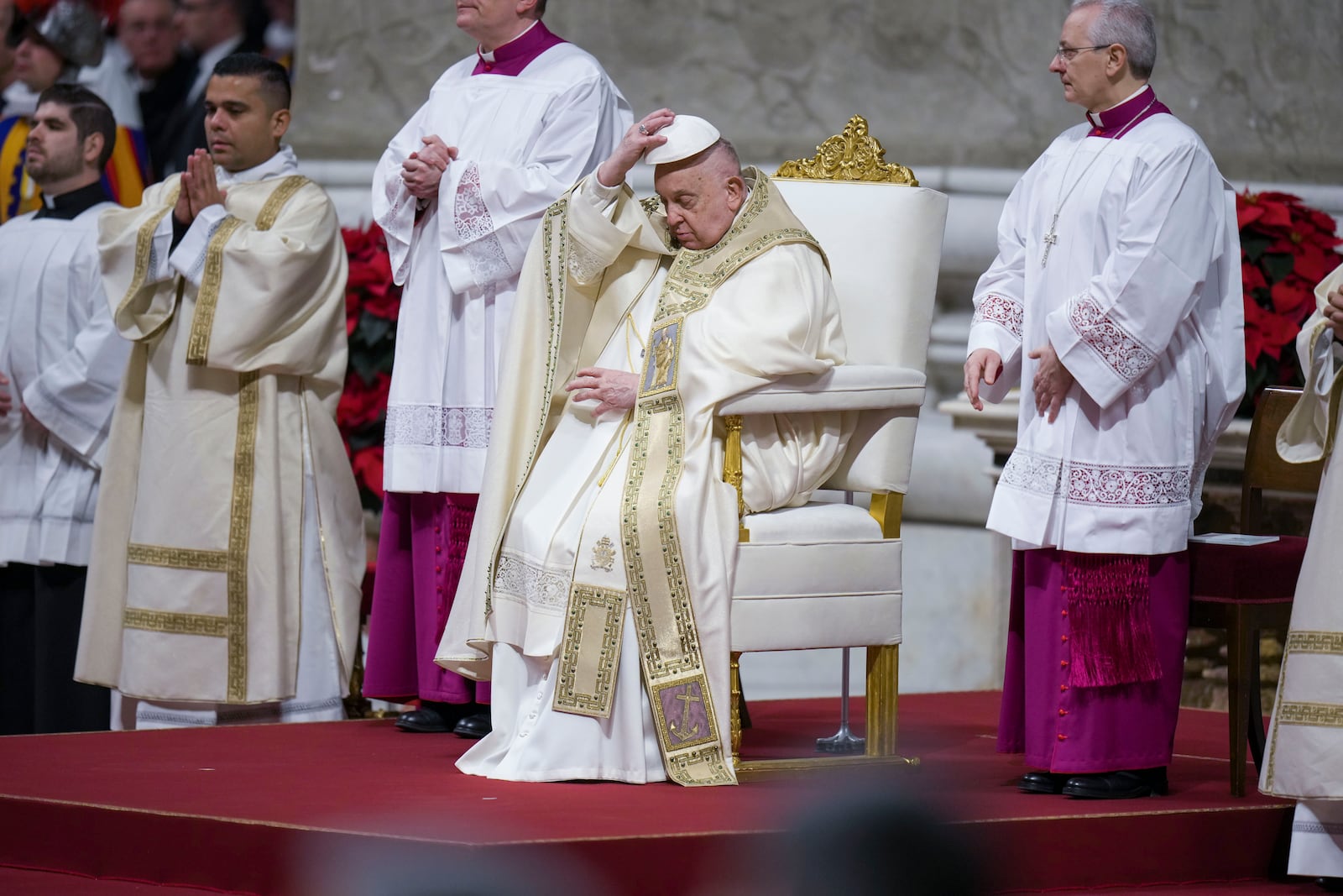 Pope Francis presides over the Christmas Eve Mass in St. Peter's Basilica at The Vatican, Tuesday, Dec. 24, 2024, after opening the basilica's holy door marking the start of the Catholic jubilar year 2025. (AP Photo/Andrew Medichini)