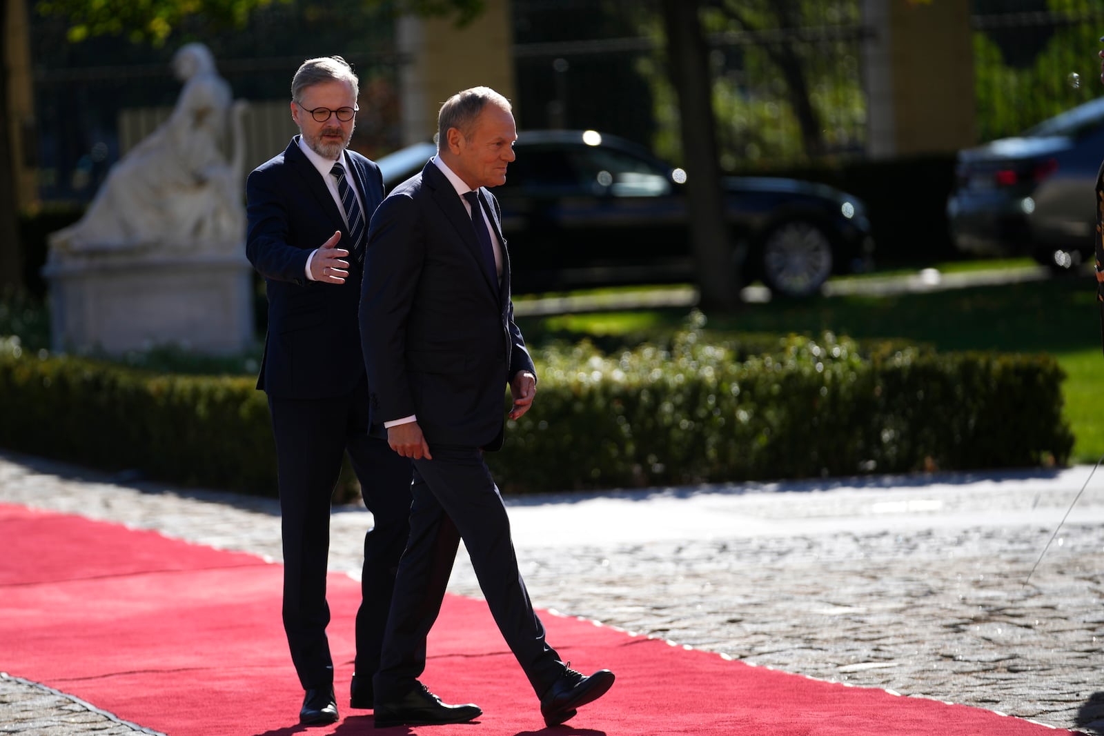 Czech Republic's Prime Minister Petr Fiala, left, welcomes his Poland's counterpart Donald Tusk as they meet in Prague, Czech Republic, Wednesday, Oct. 9, 2024. (AP Photo/Petr David Josek)