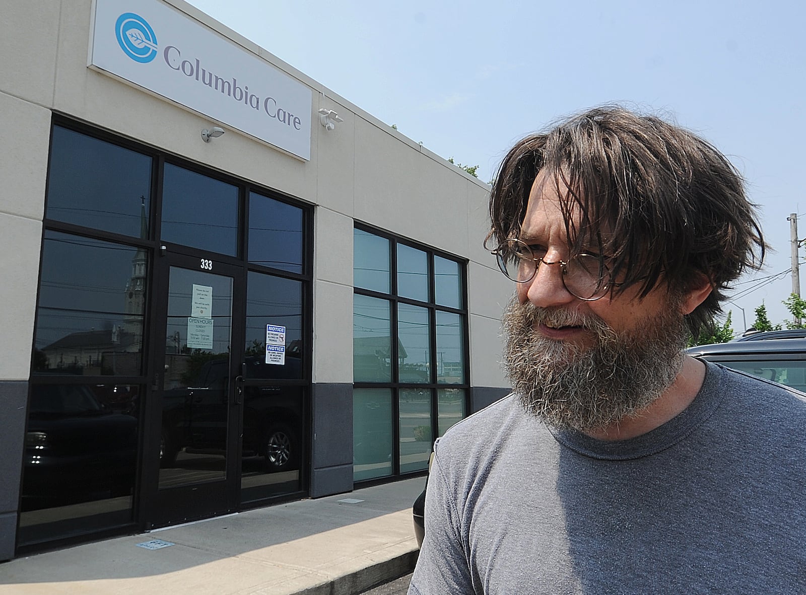 A patient of Ohio's medical marijuana program stops at Columbia Care in Dayton on to pick up products that help him with difficulty sleeping and stomach issues. MARSHALL GORBY\STAFF