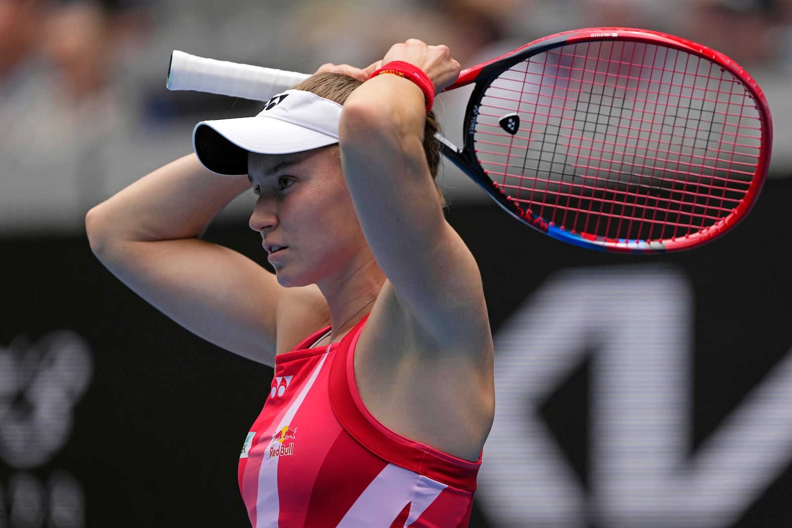 Elena Rybakina of Kazakhstan adjusts her hair during her second round match against Iva Jovic of the U.S. at the Australian Open tennis championship in Melbourne, Australia, Thursday, Jan. 16, 2025. (AP Photo/Vincent Thian)