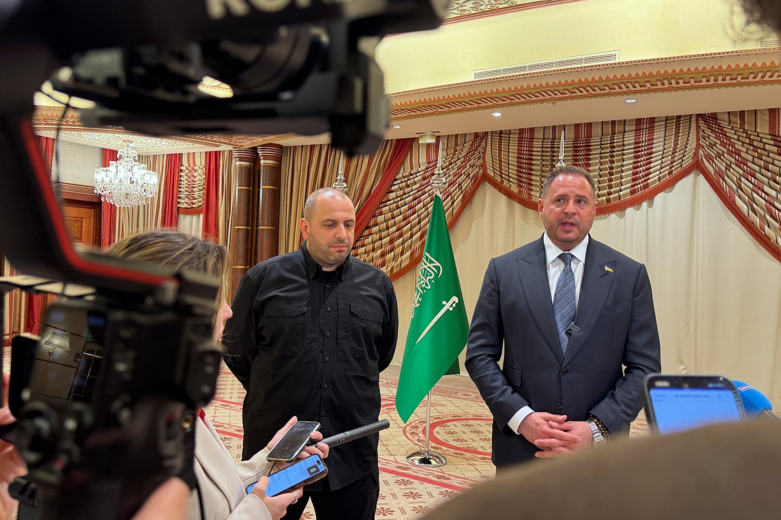 Ukrainian Head of Presidential Office Andriy Yermak, right, and Ukrainian Minister of Defense Rustem Umerov speak to journalists in Jeddah, Saudi Arabia, Tuesday, March 11, 2025. (AP Photo/Baraa Anwer)