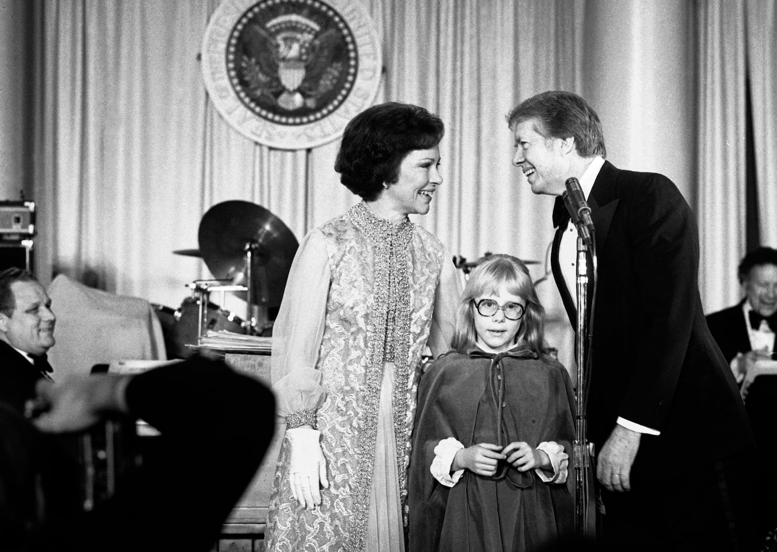 FILE - President Jimmy Carter and first lady Rosalynn Carter are pictured with their daughter Amy at the first of seven inaugural balls in Washington, Jan. 20, 1977, at the Pension Building. (AP Photo, File)