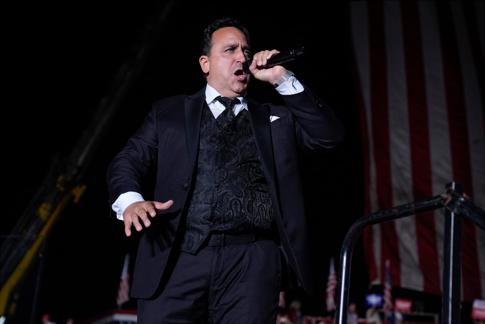 FILE - Opera singer Christopher Macchio sings at a campaign rally, Saturday, Oct. 5, 2024, in Butler, Pa. (AP Photo/Evan Vucci, File)