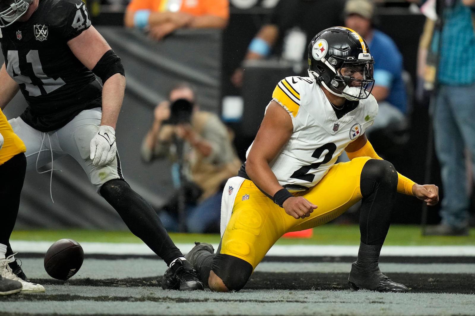 Pittsburgh Steelers quarterback Justin Fields (2) reacts after scoring against the Las Vegas Raiders during the second half of an NFL football game in Las Vegas, Sunday, Oct. 13, 2024. (AP Photo/John Locher)