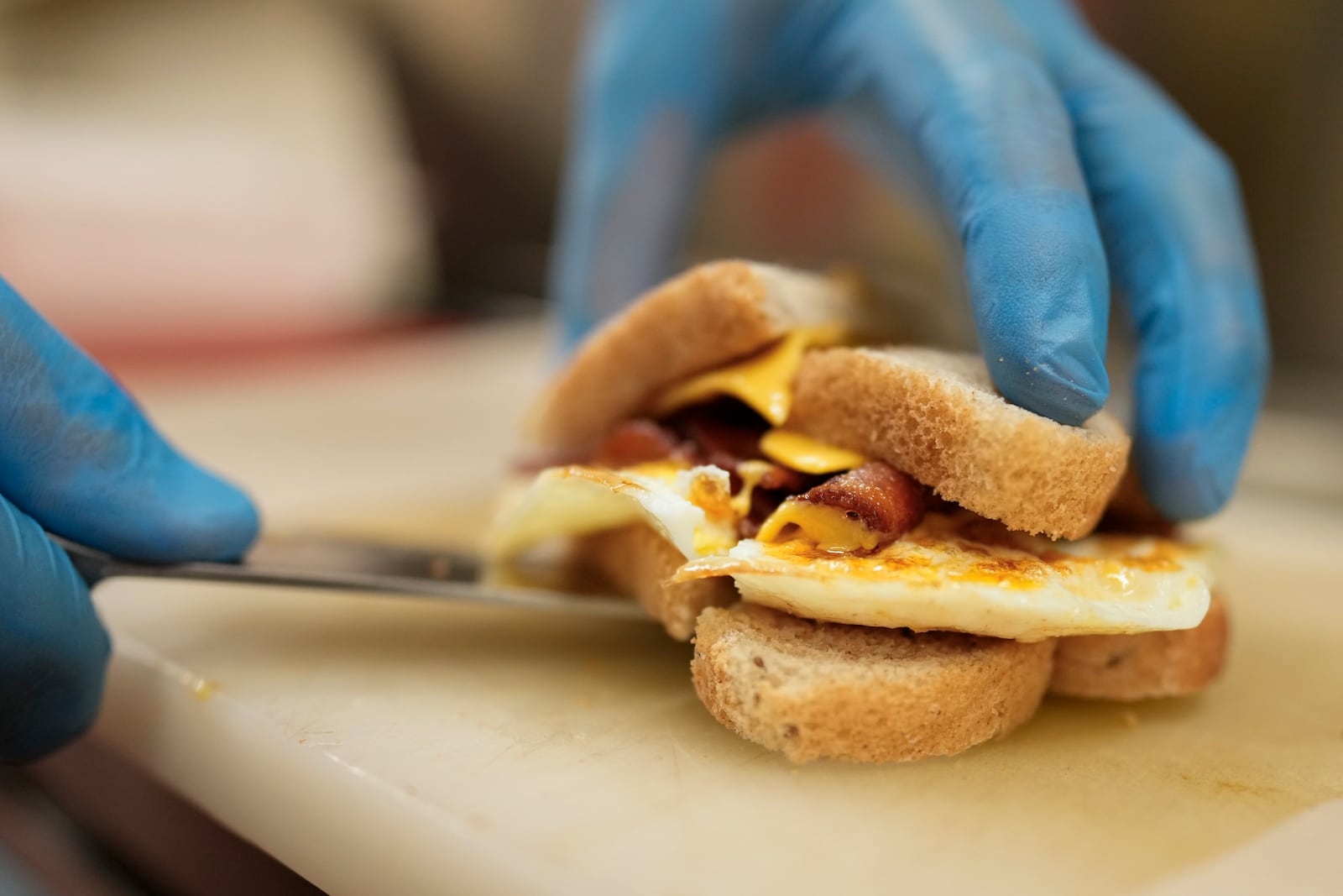 Chris Barton makes a bacon egg and cheese breakfast sandwich at the Pepper Pod Restaurant, Thursday, Feb.13, 2025, Newport, Ky. (AP Photo/Carolyn Kaster)