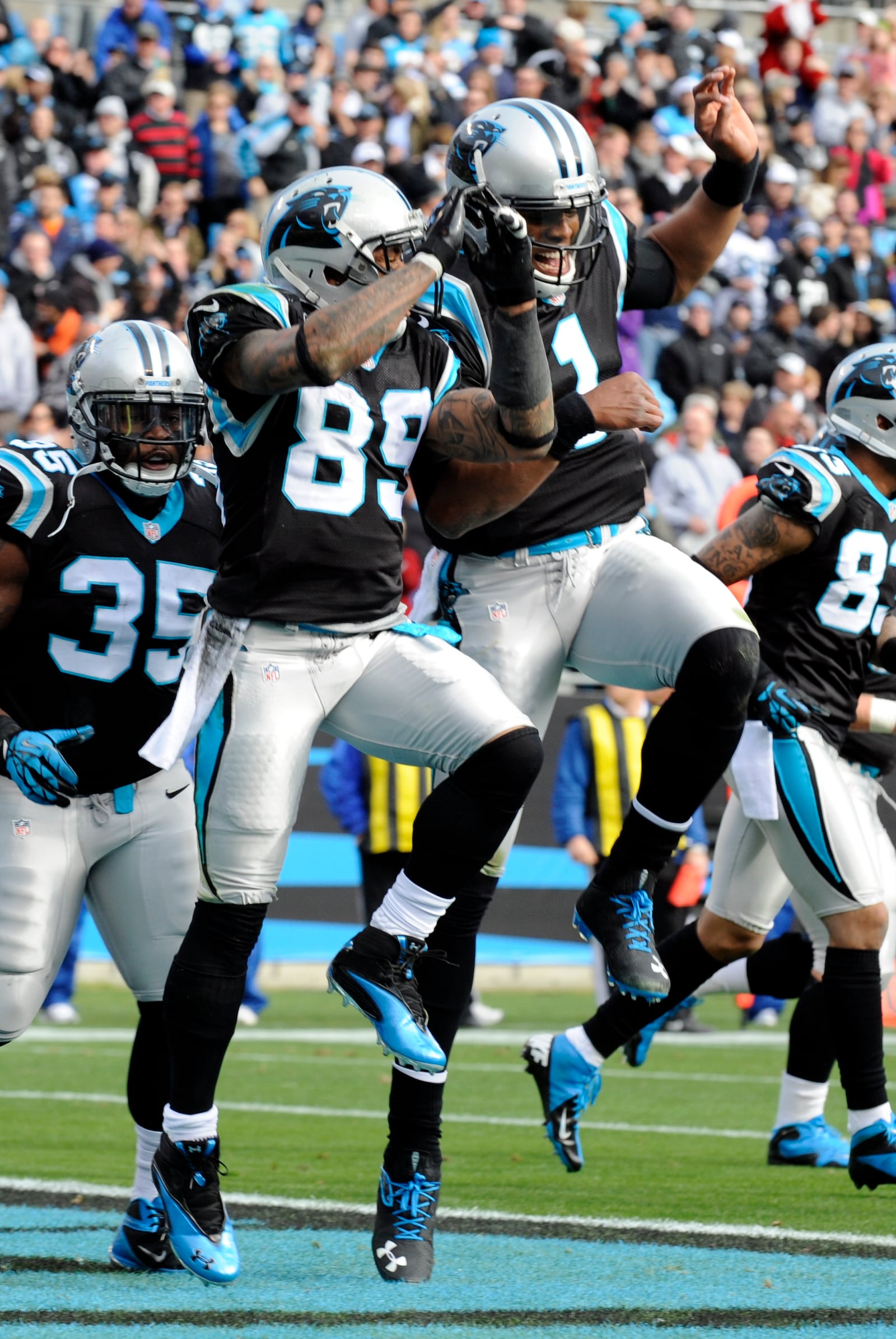 FILE - Carolina Panthers' Steve Smith (89) and Cam Newton (1) celebrate Smith's touchdown catch against the Oakland Raiders during the first half of an NFL football game in Charlotte, N.C., Sunday, Dec. 23, 2012. (AP Photo/Mike McCarn, File)