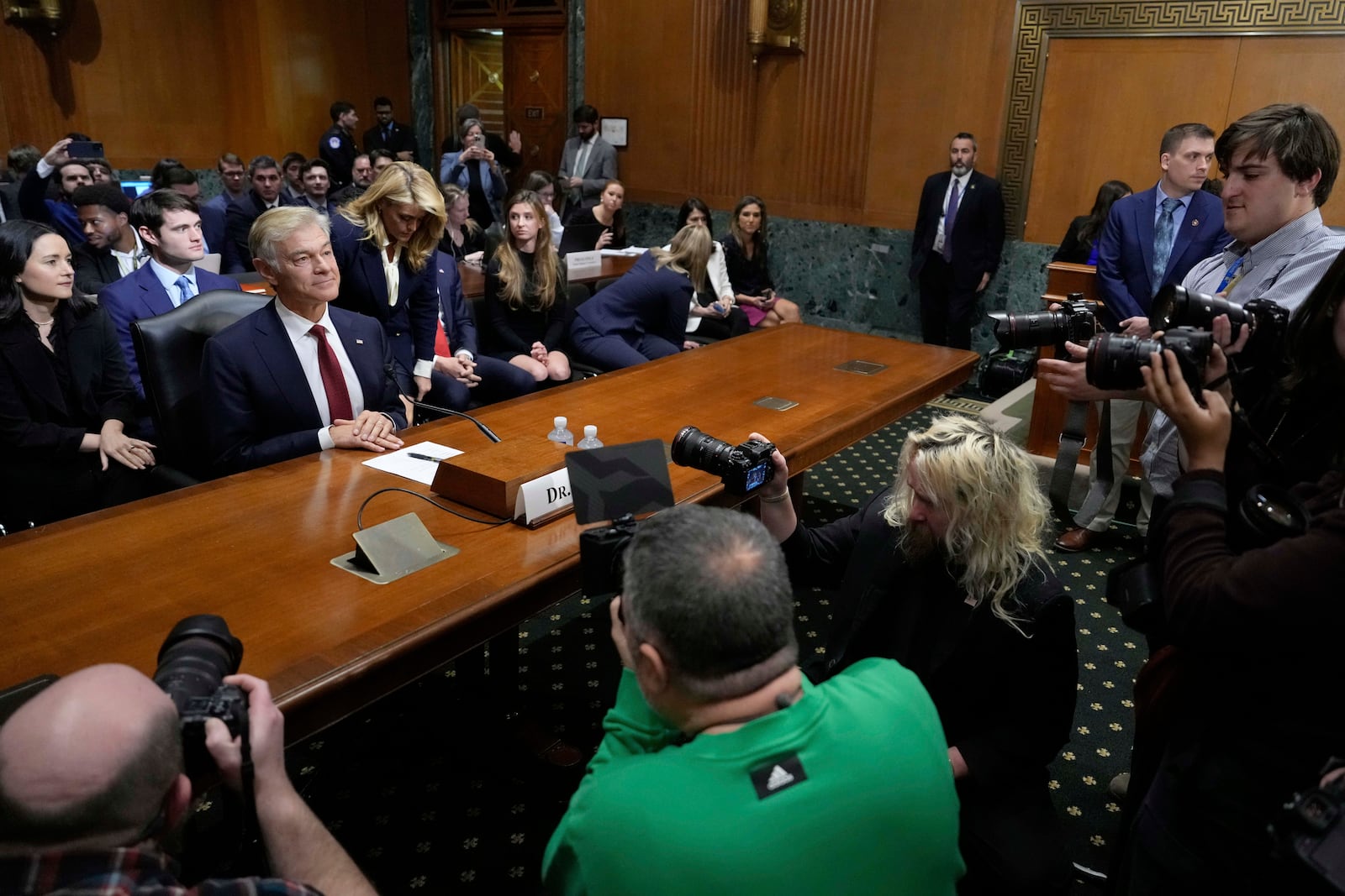 Dr. Mehmet Oz, President Donald Trump's pick to lead the Centers for Medicare and Medicaid Services, sits before testifying at his confirmation hearing before the Senate Finance Committee, on Capitol Hill in Washington, Friday, March 14, 2025. (AP Photo/Ben Curtis)