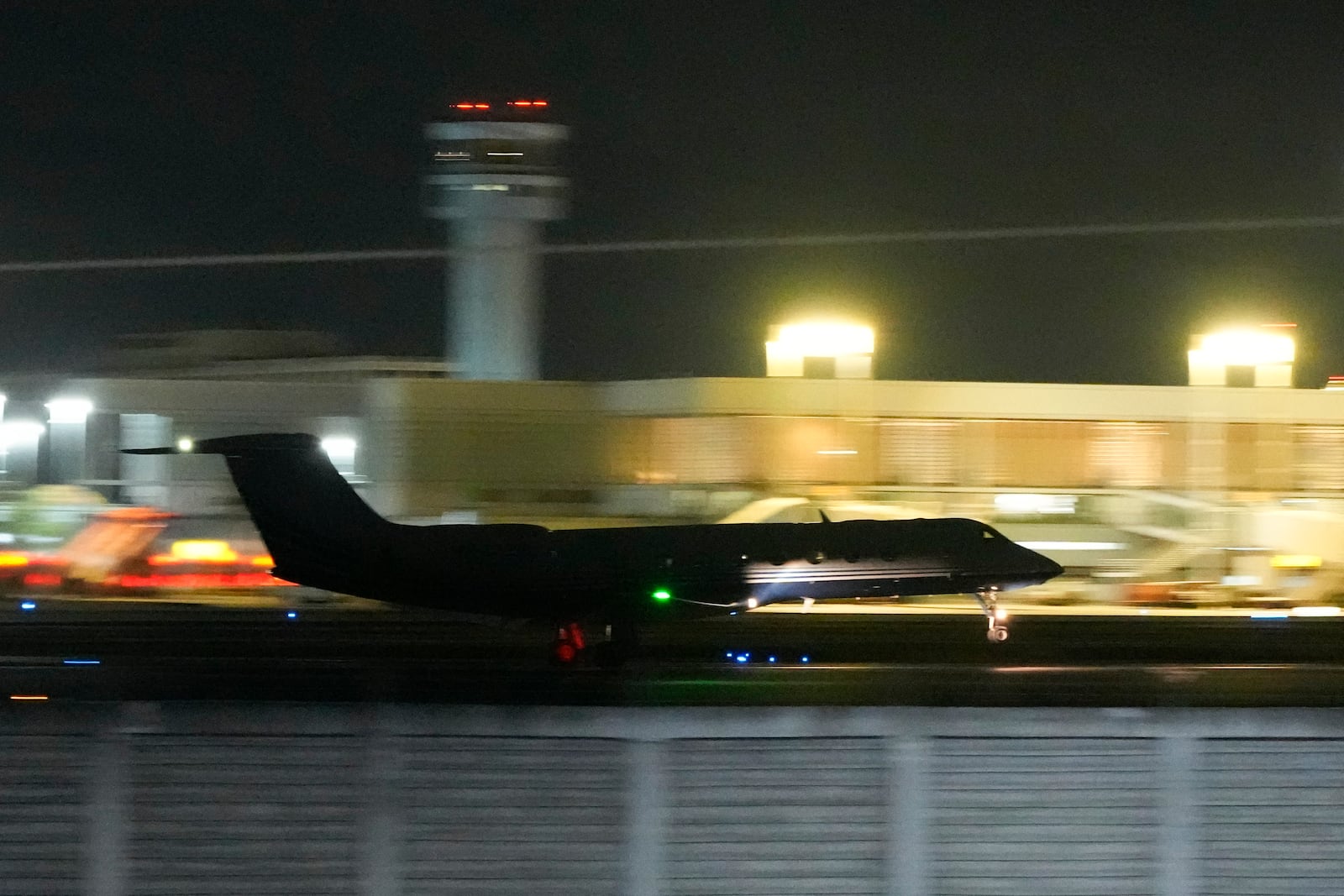 A plane carrying former President Rodrigo Duterte to The Hague takes off in Manila, Philippines on Tuesday, March 11, 2025. (AP Photo/Aaron Favila)