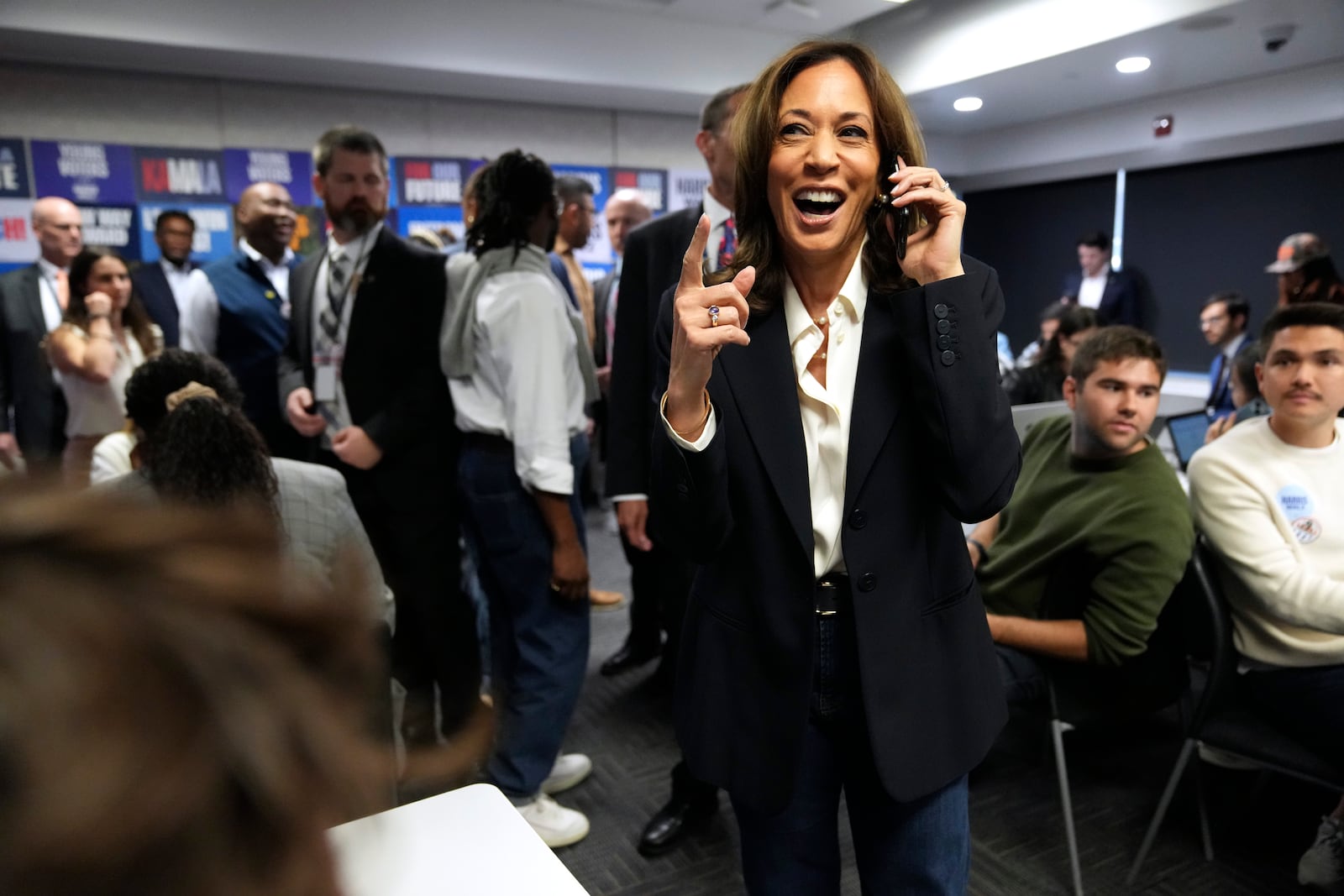 Democratic presidential nominee Vice President Kamala Harris, right, phone banks with volunteers at the DNC headquarters on Election Day, Tuesday, Nov. 5, 2024, in Washington. (AP Photo/Jacquelyn Martin)