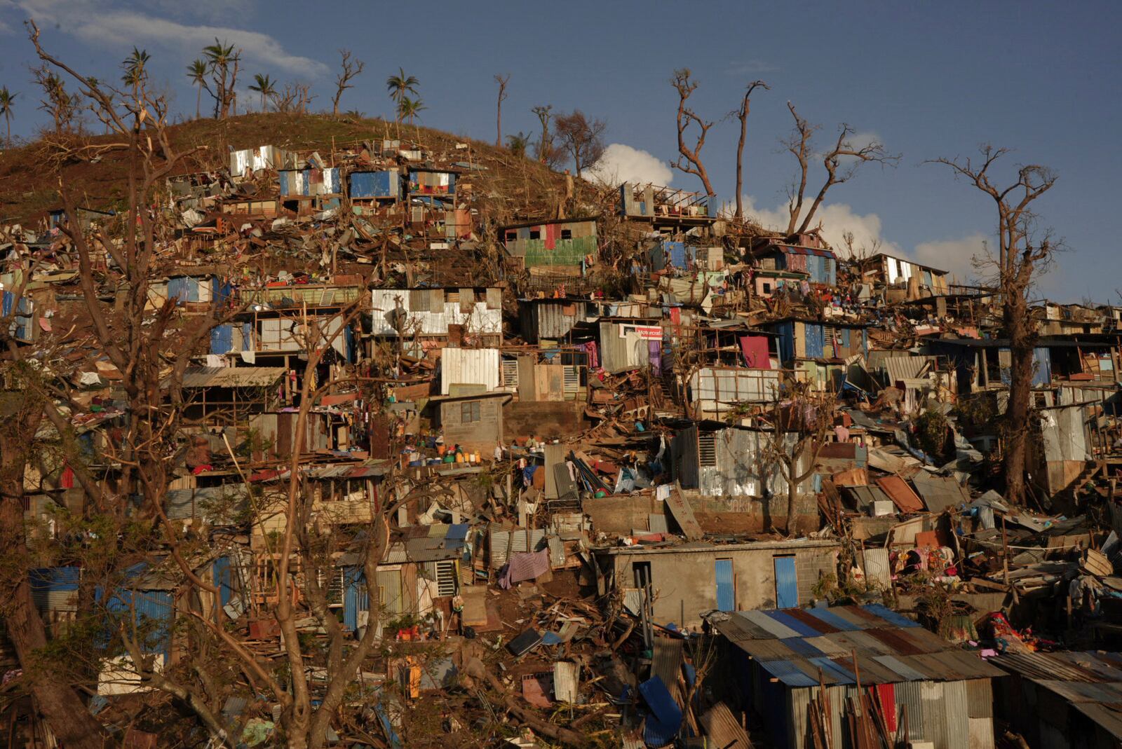 Damage is seen in the Kaweni slum Thursday, Dec. 19, 2024, on the outskirts of Mamoudzou, in the French Indian Ocean island of Mayotte, after Cyclone Chido. (AP Photo/Adrienne Surprenant)