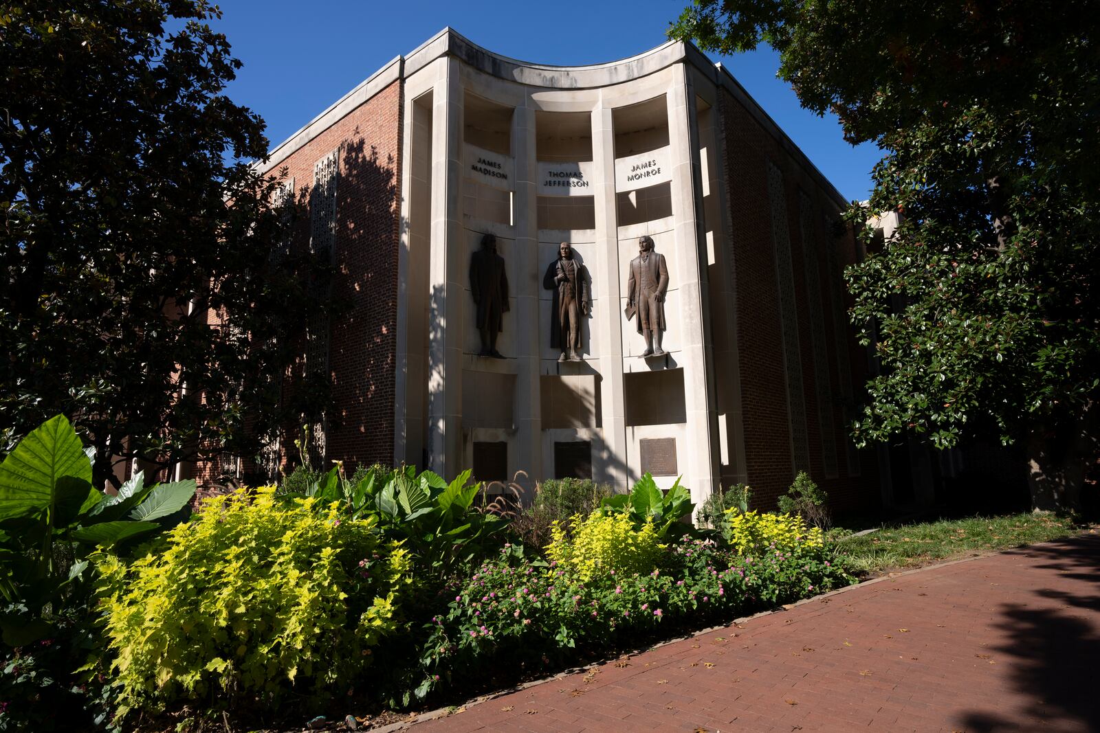 Statues of James Madison, Thomas Jefferson and James Monroe are seen at the city hall Oct. 10, 2024, in Charlottesville, Va. (AP Photo/Serkan Gurbuz)