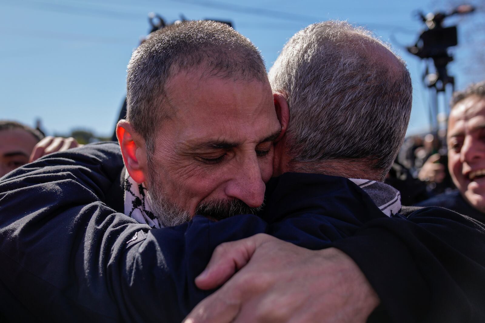 A Palestinian prisoner, left, is greeted after being released from Israeli prison following a ceasefire agreement between Israel and Hamas, in the West Bank city of Ramallah, Saturday, Feb. 15, 2025. (AP Photo/Nasser Nasser)