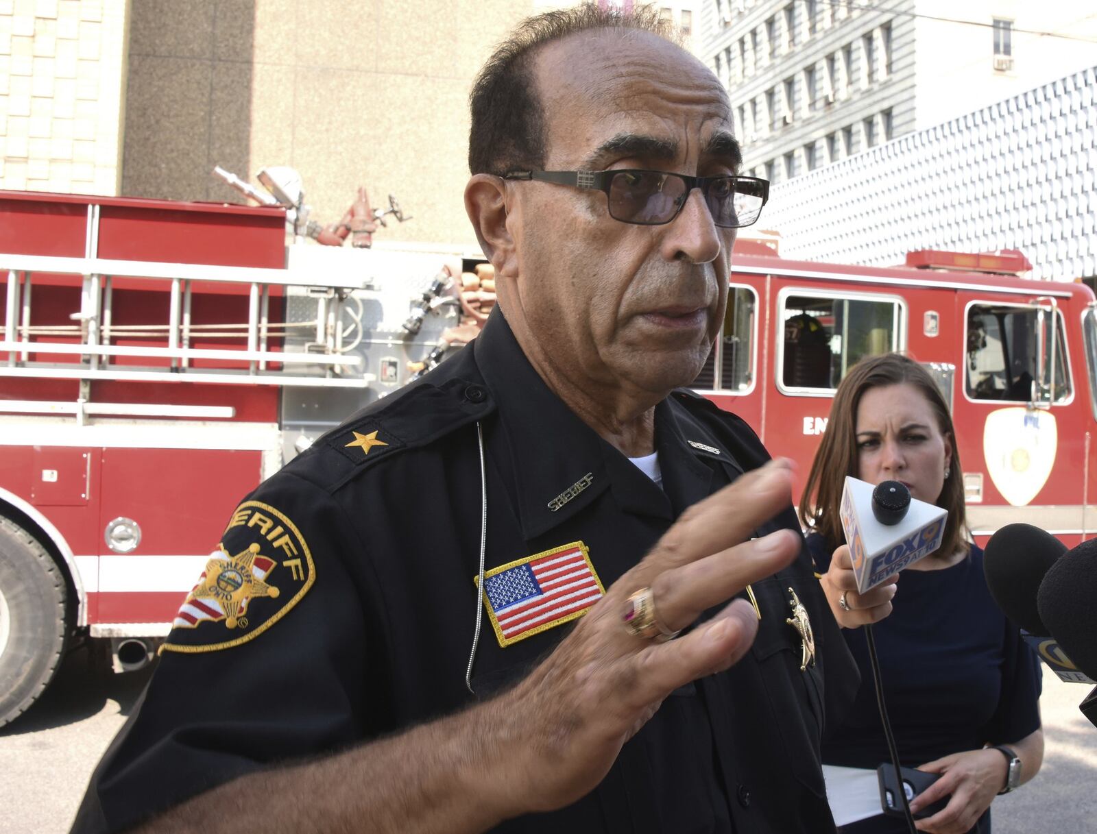 Jefferson County Sheriff Fred Abdalla talks about the shooting of Jefferson County Judge Joseph Bruzzese Jr. adjacent to the Courthouse, Monday Aug. 21, 2017 in Steubenville , Ohio. Abdallah says courthouse video shows Bruzzese firing about five shots at the gunman, who also fired about five shots before a probation officer ultimately killed the suspect. (Darrell Sapp/Post-Gazette)/Pittsburgh Post-Gazette via AP)