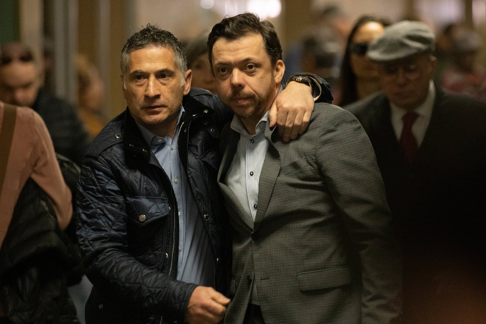 Tim Oliver Lee, right, brother of Cash App founder Bob Lee, and Bob's friend Michael Lanza embrace as they walk into the courtroom, Tuesday, Dec. 17, 2024, in San Francisco,, for the verdict in the trial of Nima Momeni, who is charged with killing Bob Lee, (Stephen Lam/San Francisco Chronicle via AP)