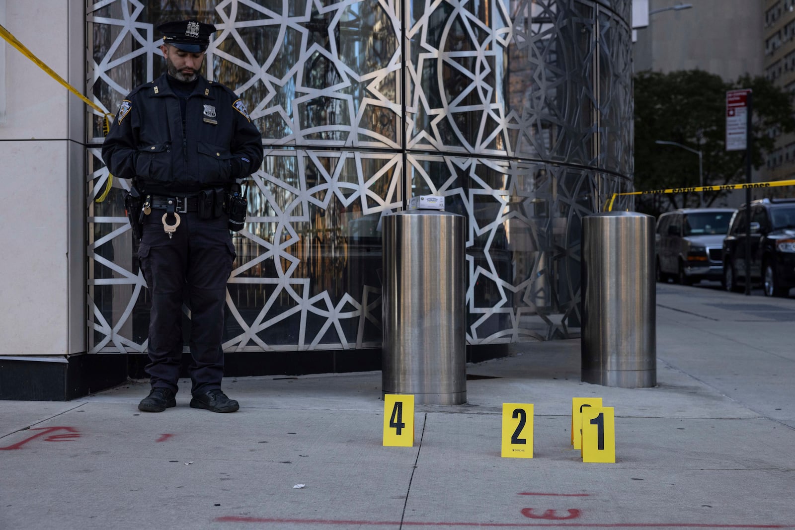 NYPD officers stand at the site where the suspect of a stabbing spree was captured outside Turkish House, New York, Monday, Nov. 18, 2024. (AP Photo/Yuki Iwamura)