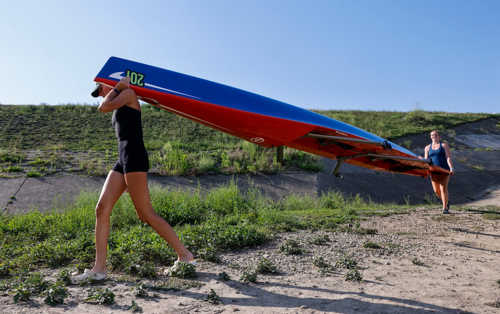 Annalie Duncomb, 16, from Mason, left, and Annelise Hahl, 16, from North Carolina, get ready for practice Thursday, Aug. 25, 2022 in Hamilton. Duncomb, Hahl and others with The Great Miami Rowing Club are heading to Wales where they will be training for and then competing in the 2022 World Coastal Championships and Beach Sprint Finals. NICK GRAHAM/STAFF