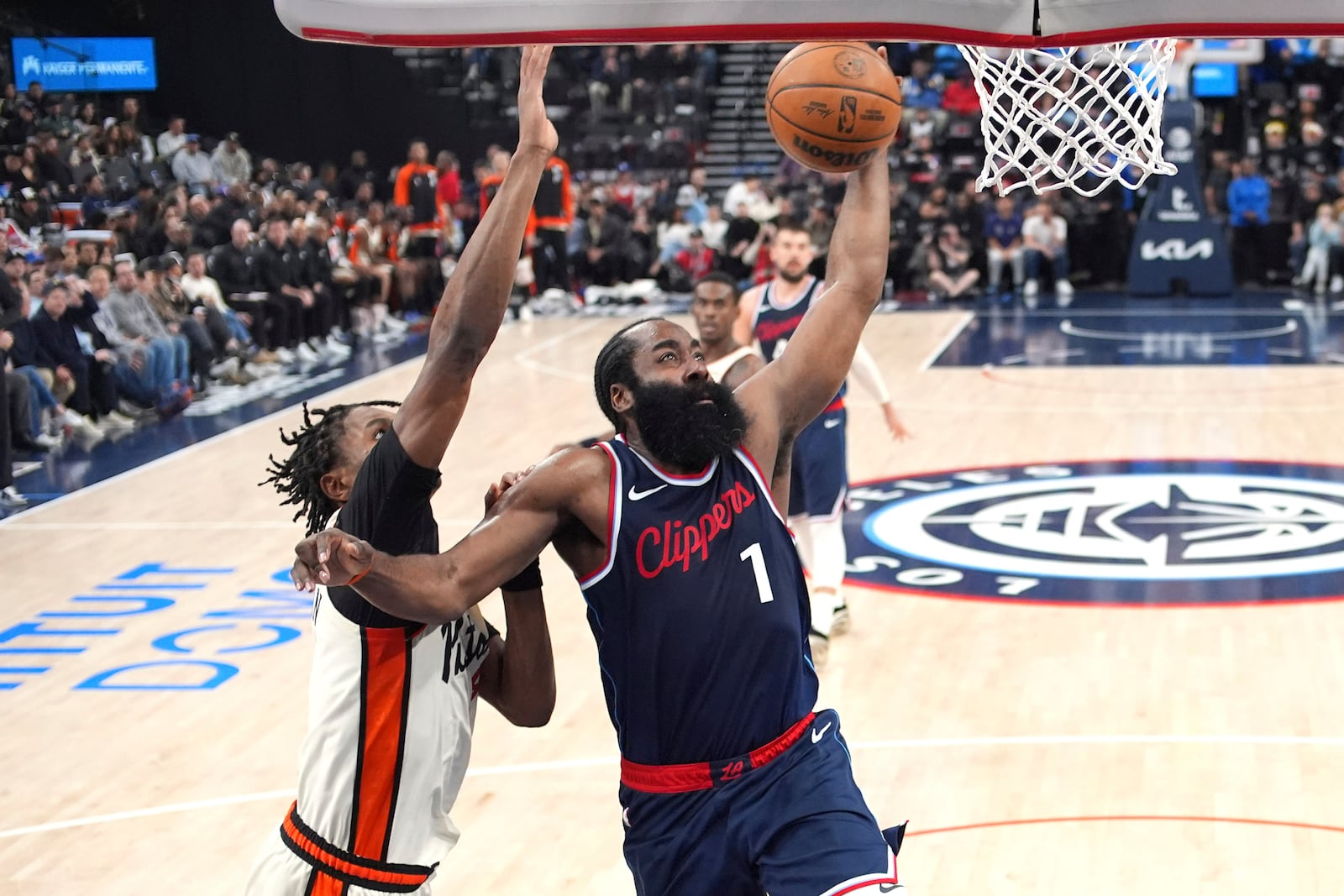 Los Angeles Clippers guard James Harden, right, shoots as Detroit Pistons forward Ausar Thompson defends during the first half of an NBA basketball game Wednesday, March 5, 2025, in Inglewood, Calif. (AP Photo/Mark J. Terrill)