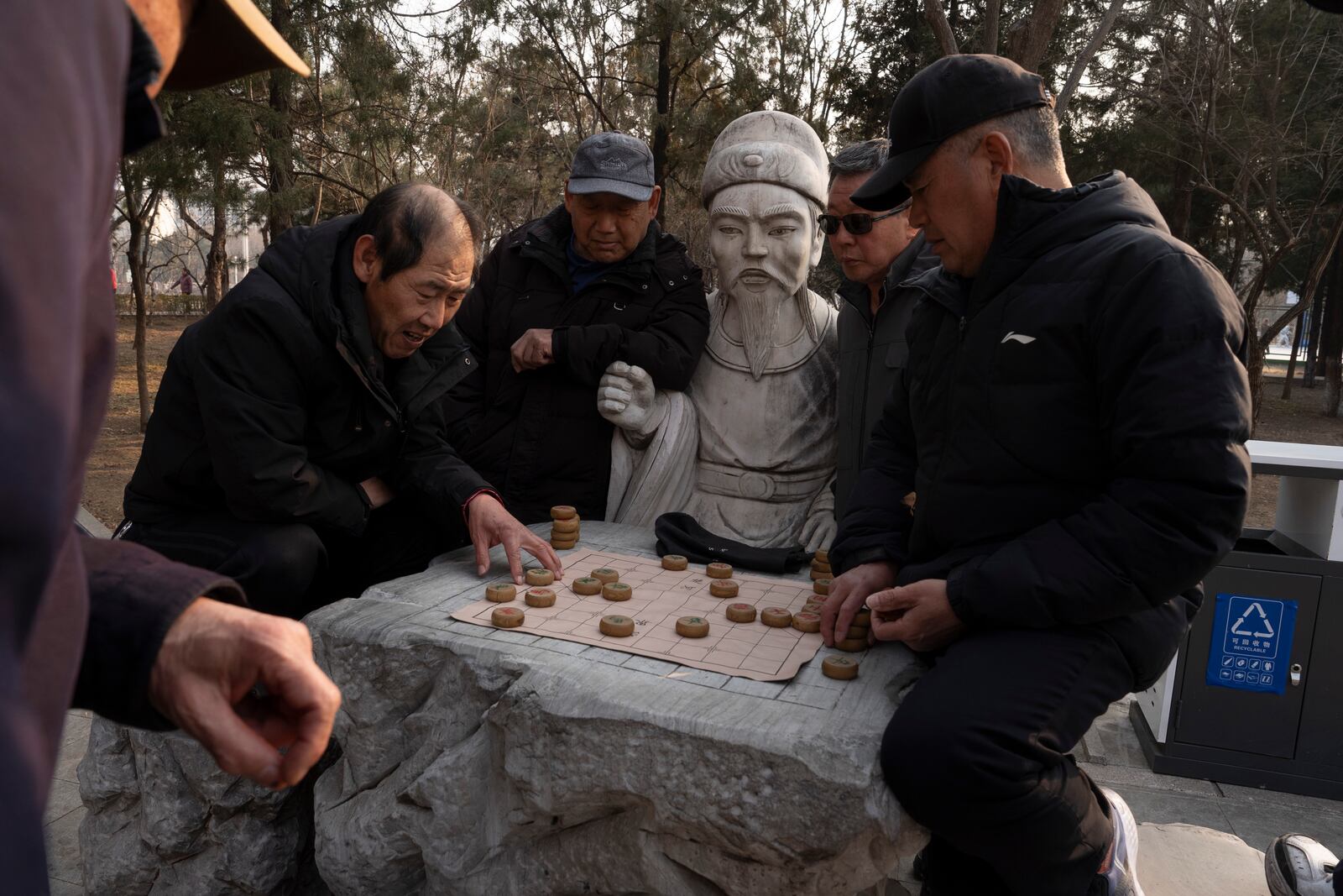 Residents play chess at a park in northeastern Beijing's Miyun district, on Feb. 27, 2025. (AP Photo/Ng Han Guan)