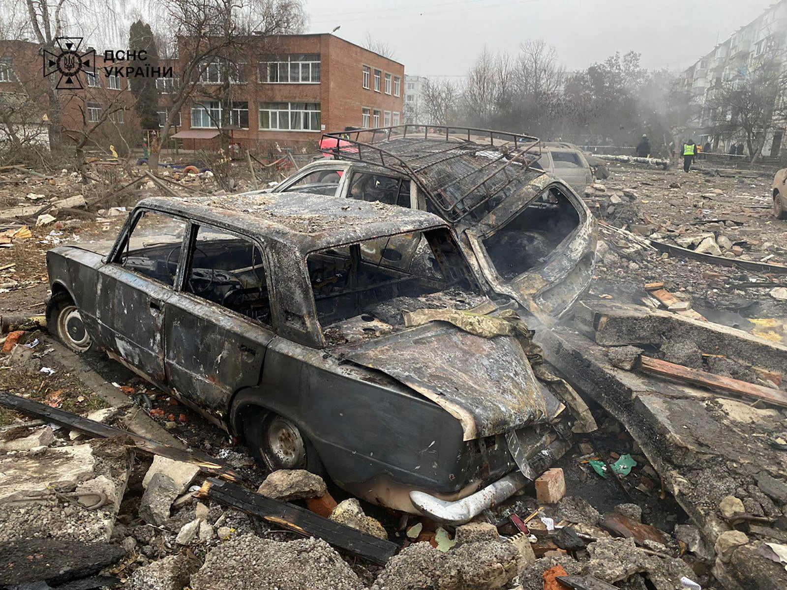 In this photo provided by the Ukrainian Emergency Service, damaged cars are seen near a ruined apartment building following a Russian rocket attack in Poltava, Ukraine, Saturday, Feb. 1, 2025. (Ukrainian Emergency Service via AP)